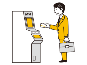 ATMを操作する男性